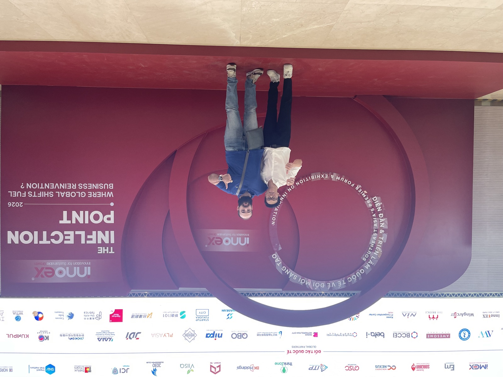 Vietnam Fieldwork founders Đức Nhật and Timothy Ericsson smiling and giving a thumbs-up at InnoEx 2026